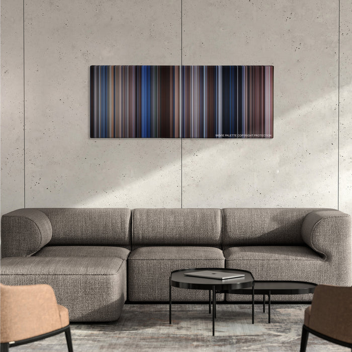The Bodyguard color palette canvas on a concrete wall above a gray sectional sofa
