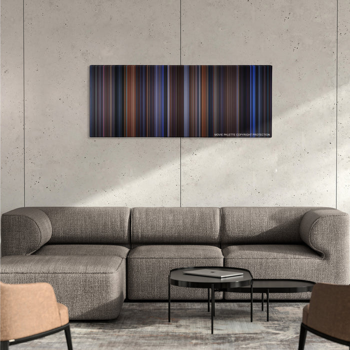 The Cable Guy color palette canvas on a concrete wall above a gray sectional sofa