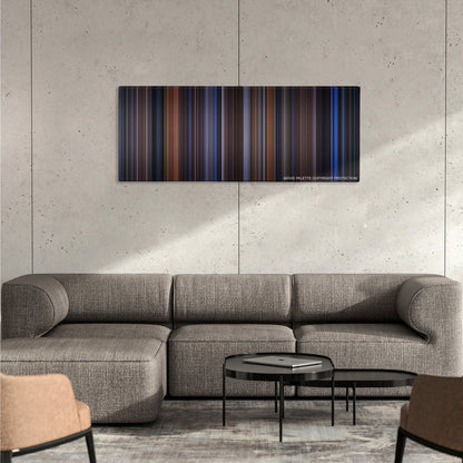 The Cable Guy color palette canvas on a concrete wall above a gray sectional sofa