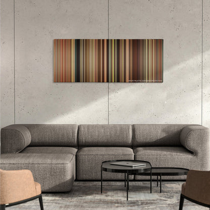The Help color palette canvas on a concrete wall above a gray sectional sofa