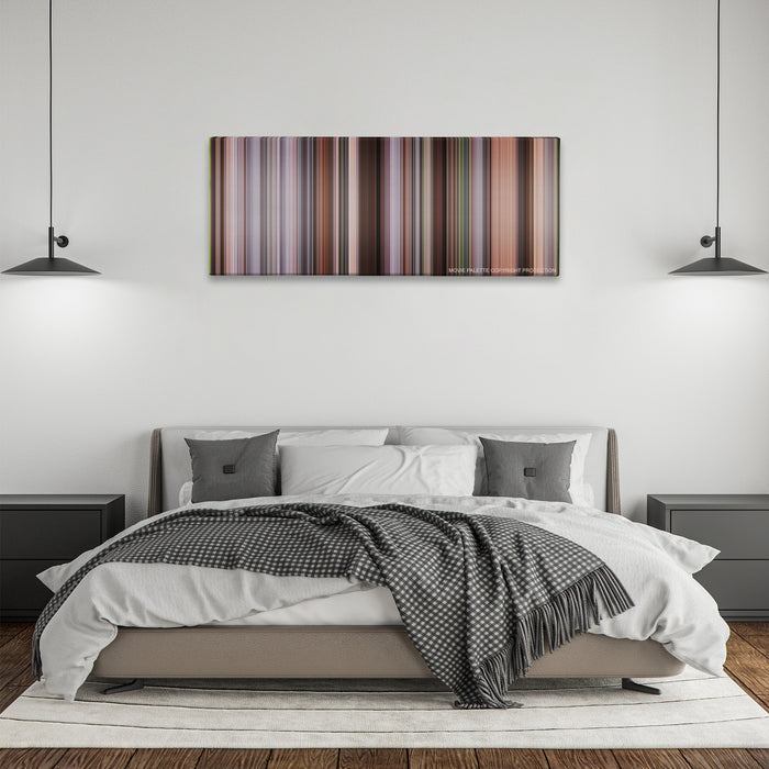 The Intern color palette canvas above a bed, between two black pendant lamps