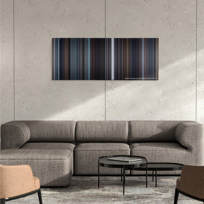 The King's Speech color palette canvas on a concrete wall above a gray sectional sofa
