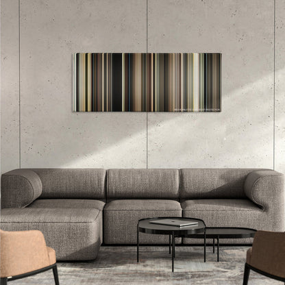 The Master color palette canvas on a concrete wall above a gray sectional sofa