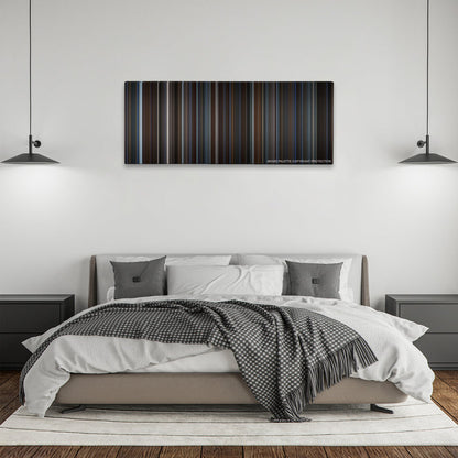 The Prestige color palette canvas above a bed, between two black pendant lamps