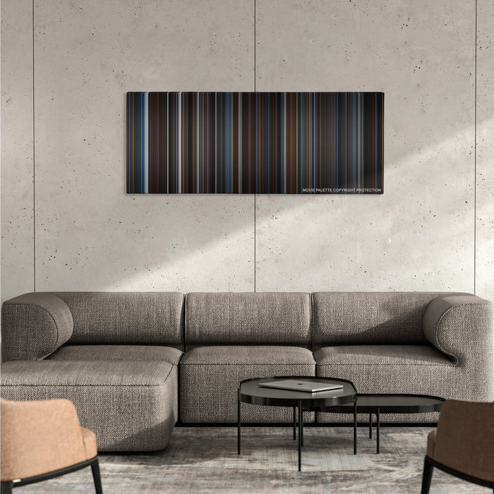 The Prestige color palette canvas on a concrete wall above a gray sectional sofa