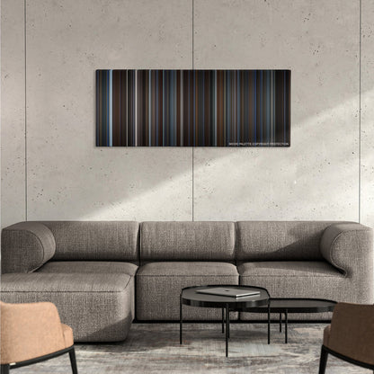 The Prestige color palette canvas on a concrete wall above a gray sectional sofa