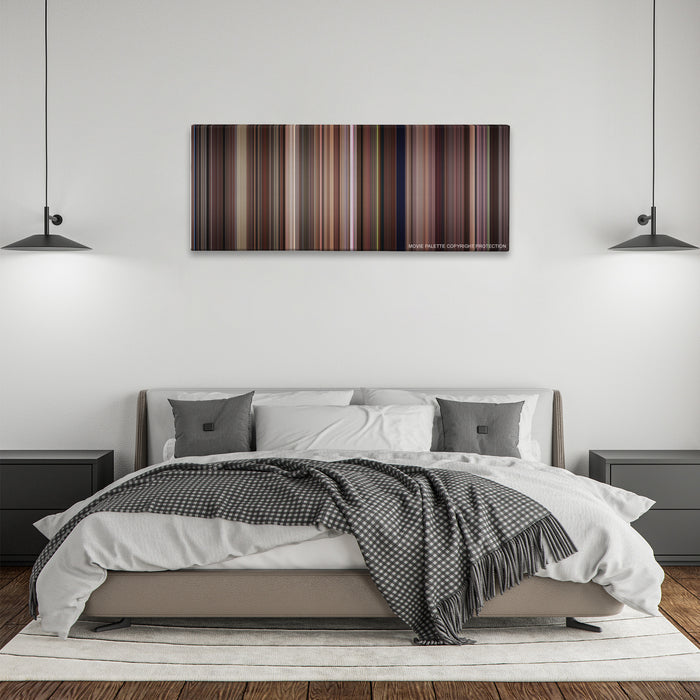 Tootsie color palette canvas above a bed, between two black pendant lamps