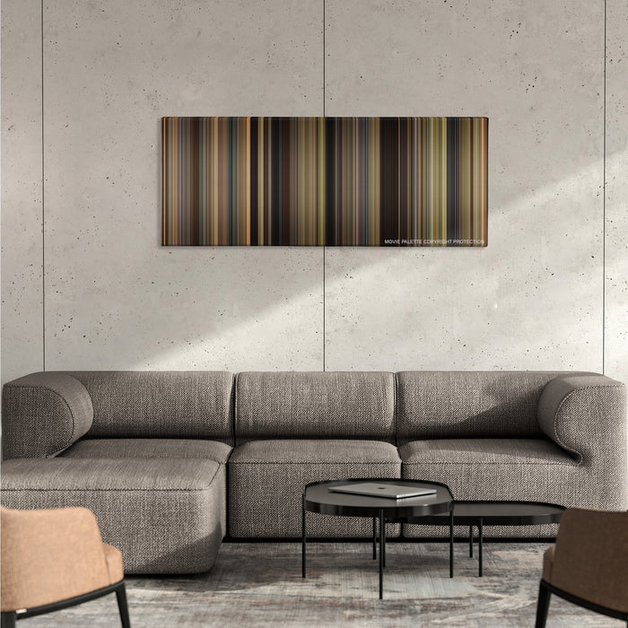 We Bought a Zoo color palette canvas on a concrete wall above a gray sectional sofa