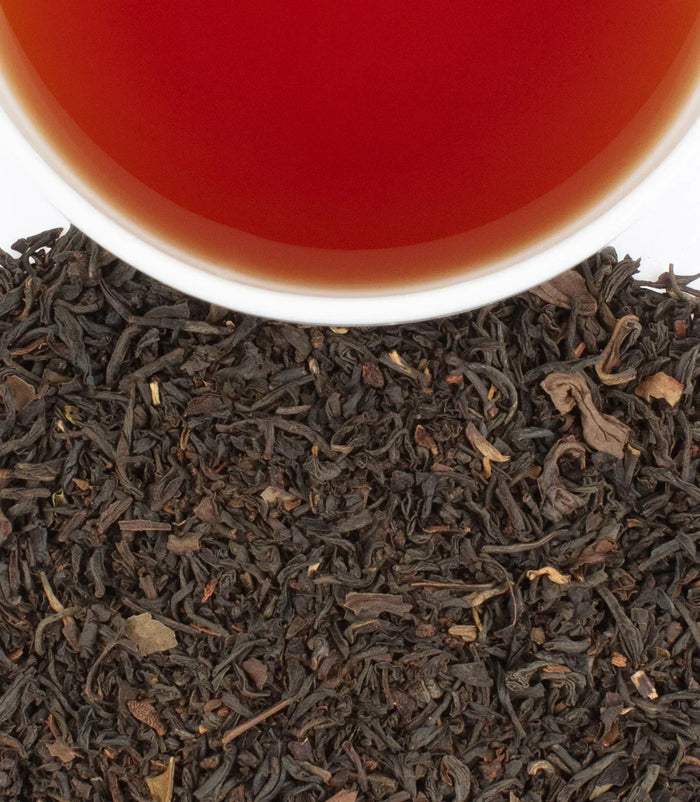 Williamsburg Earl Grey Tea by Harney & Sons — dry blend beside a brewed cup for illustration; cups are separate