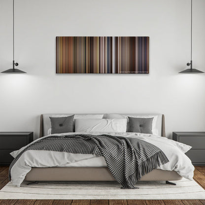 Willow color palette canvas above a bed, between two black pendant lamps
